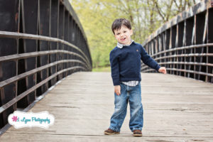 boy on bridge with smile