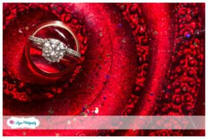 wedding rings on red plate