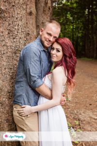 engaged couple in forest at Stony Creek