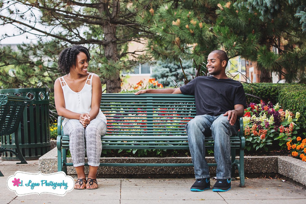 engaged couple on park bench