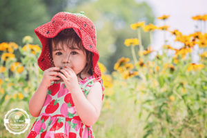 Girl eating strawberry