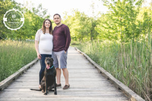pregnant couple with dog