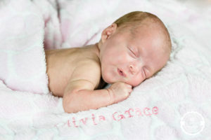 newborn smiling in sleep