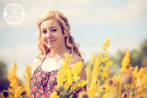 woman smiling in wildflower field