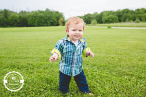 child walking in grass on farm