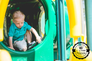 boy in tunnel at playground